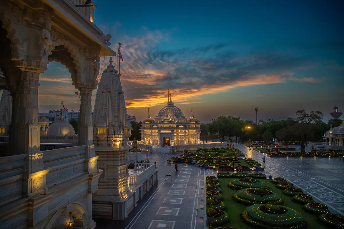 The mandir at twilight seen from a marble terrace